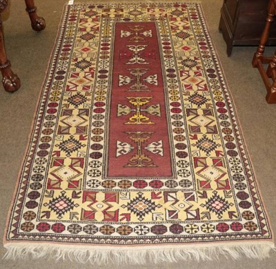 Lot 1242 - Melas Rug, West Anatolia, the chestnut brown field of geometric motifs enclosed by stylised...