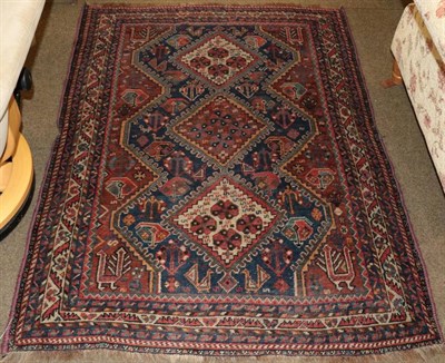 Lot 1251 - Khamseh rug, South West Iran, circa 1920, the stepped indigo field of tribal motifs central by...