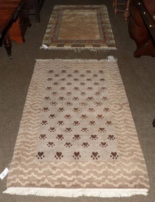 Lot 1254 - Tibetan/Nepalese rug, the dove grey field of animal paws, enclosed by striped borders, 155cm by...