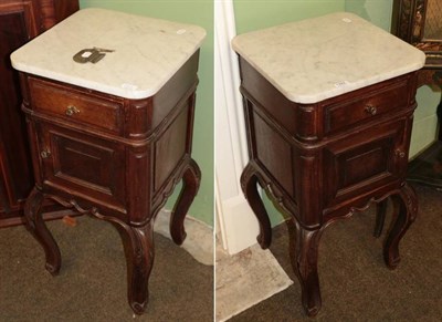 Lot 1282 - A pair of late 19th century French oak and marble top bedside cupboards