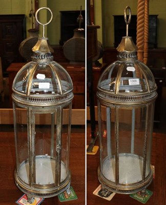 Lot 1300 - A pair of gilt metal glass lanterns (modern)