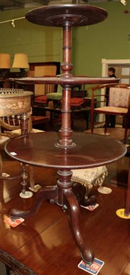 Lot 1313 - A George III mahogany three tier dumb waiter, raised on castors, 114cm high