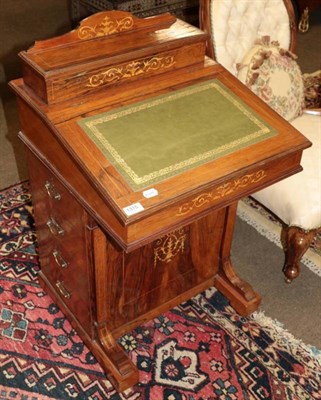 Lot 1315 - A late Victorian rosewood and marquetry inlaid Davenport, of typical form, shaped gallery green...