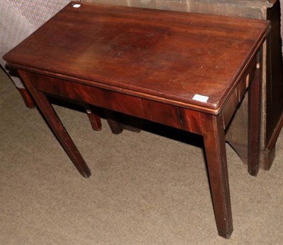 Lot 1322 - A George III mahogany fold over card table