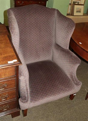 Lot 1324 - A Victorian wingback armchair, in George III style, scroll arms, square tapering legs to...