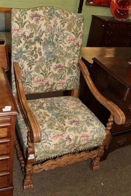 Lot 1327 - An early 20th century carved oak tapestry armchair