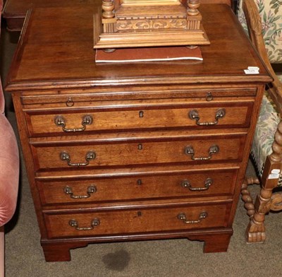 Lot 1328 - A George III style oak and mahogany crossbanded four height bachelors chest, with slide drawer,...