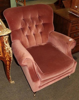 Lot 1329 - Modern pink velvet armchair, labelled Wade