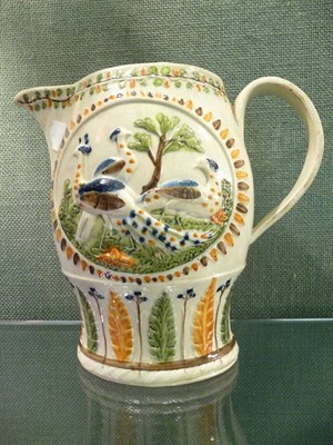 Lot 169 - A Pratt Type Pottery Jug of Flattened Ovoid Form, circa 1800, moulded with peacocks in panels...