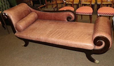 Lot 1339 - A Regency style chaise long, recovered in brown close nailed leather