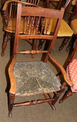 Lot 1341 - 19th century provincial fruitwood framed rocking chair with rush seat