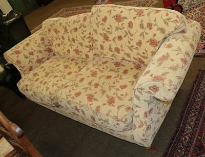 Lot 1347 - A two seater sofa (modern) covered in floral fabric