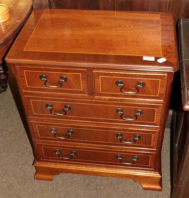 Lot 1354 - A reproduction inlaid mahogany chest of drawers of small proportions; together with a nest of three