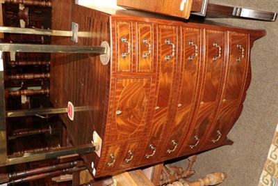 Lot 1360 - A reproduction mahogany bowfront chest of drawers, in Regency style, with four small drawers...