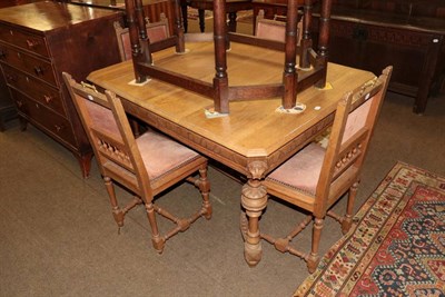 Lot 1362 - A Victorian carved oak extending dining table and four matching chairs