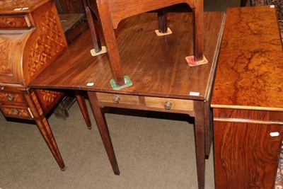 Lot 1366 - A George III mahogany drop leaf dining table with two small frieze drawers