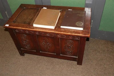 Lot 1383 - A 20th century carved oak blanket box