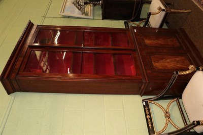 Lot 1390 - A Victorian mahogany bookcase, the upper section with glazed doors, the base as a cupboard door