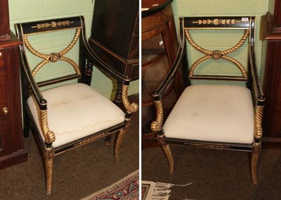 Lot 1391 - A pair of reproduction Empire style open armchairs, parcel gilt black painted and with rope...