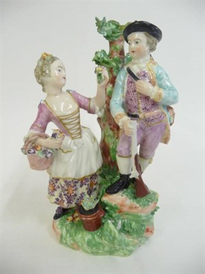 Lot 175 - A Derby Figure of a Hunter and Companion, circa 1800, all picked out in coloured enamels, on a...