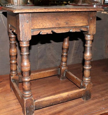 Lot 1394 - A 20th century oak stool in 18th century style