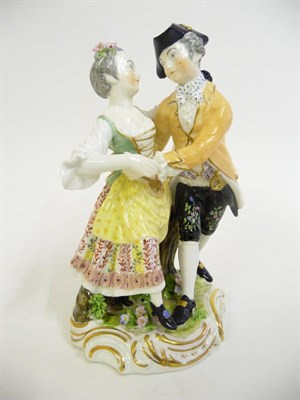 Lot 177 - A Derby Figure of Dancers, circa 1800, the gentleman wearing a tricorn hat, the girl with a...