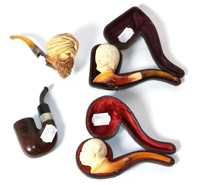 Lot 178 - Three meerschaum pipes, each well carved as busts, together with a further pipe for the Cold Stream