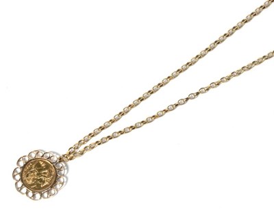 Lot 184 - A 1982 half sovereign coin loose mounted as a pendant on a belcher link chain, stamped '9CT',...