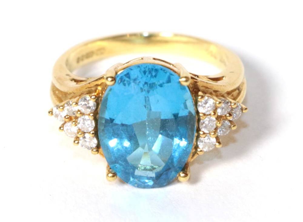 Lot 189 - An 18 carat gold blue topaz and diamond ring, finger size N