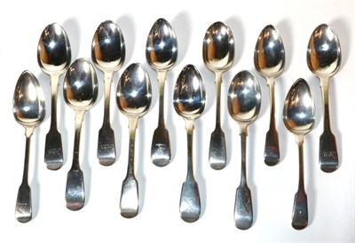 Lot 194 - A group of twelve assorted George III and later silver fiddle pattern dessert spoons, various...