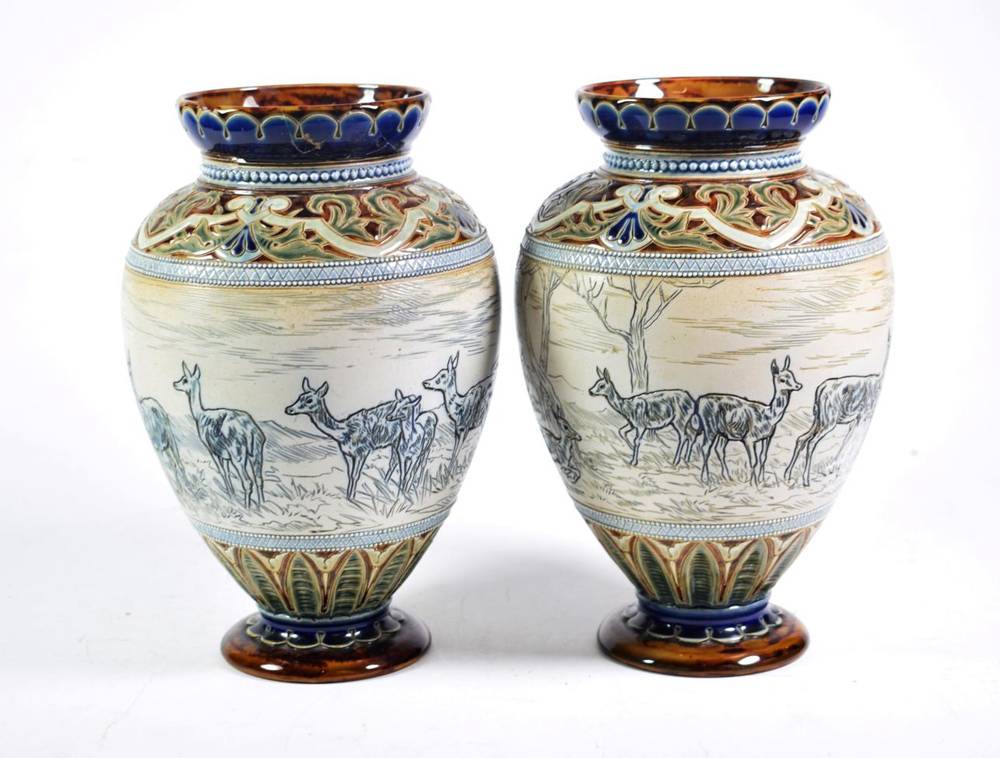 Lot 226 - A pair of Doulton Lambeth vases by Elizabeth Barlow, decorated with deer in landscapes (one a.f.)
