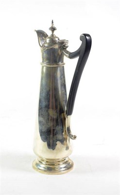 Lot 242 - An Edwardian silver claret jug, George Howson Sheffield 1903, of plain tapering slender form,...
