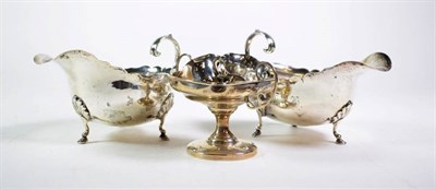 Lot 253 - A pair of George II style silver sauceboats, by Nathan & Hayes, Birmingham, 1893, approximately...