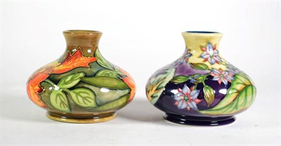 Lot 257 - A Moorcroft pottery ''Flame of the Forest'' pattern vase designed by Philip Gibson with painted and