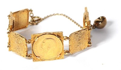 Lot 271 - A 9 carat gold textured link bracelet set with three full sovereigns, 1912, 1913 and 1928....