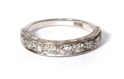 Lot 284 - A diamond half hoop ring stamped '18CT', finger size S