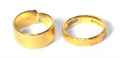 Lot 286 - A 22 carat gold band ring, patterned, finger size L; and a cut 22 carat gold band ring (2)