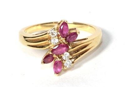 Lot 297 - A ruby and diamond spray ring, stamped '18K', finger size N