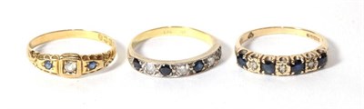 Lot 299 - An 18 carat sapphire and diamond ring, finger size Q; an 18 carat gold sapphire and diamond...