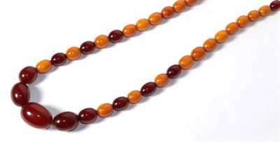 Lot 303 - A string of amber beads, length 78cm