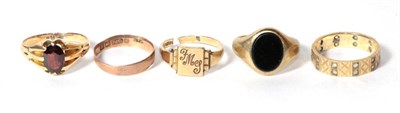 Lot 310 - A garnet ring, stamped '15C', finger size R; a 9 carat gold band ring, finger size N1/2; a 9...