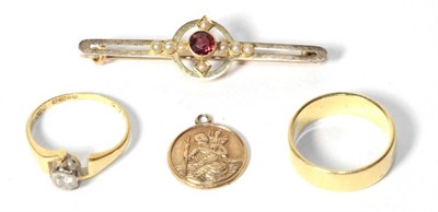 Lot 320 - An 18 carat gold band ring, finger size L; an 18 carat gold solitaire diamond ring, finger size...