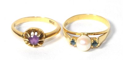 Lot 326 - An amethyst ring, finger size P; and a cultured pearl and sapphire three stone ring, stamped '750'