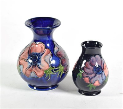 Lot 355 - A Moorcroft pottery Anemone pattern vase on a blue ground with impressed marks, 13cm high; together