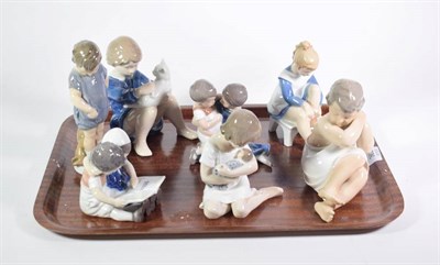 Lot 363 - A collection of four Royal Copenhagen figures of children, various dates and models; together...