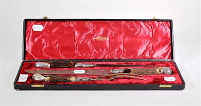 Lot 366 - A cased Victorian three piece silver mounted antler handled carving set, by J.M.Potter,...