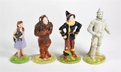Lot 370 - Set of four Royal Doulton 'Wizard of Oz' pottery figures, original boxes