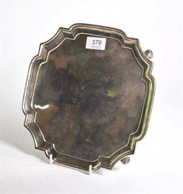 Lot 379 - A shaped square silver salver, R & W Sorley, London 1931, on four scroll supports, 26cm wide,...
