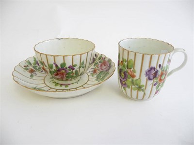 Lot 209 - A First Period Worcester Porcelain Fluted Trio, circa 1775, painted in colours with flower...