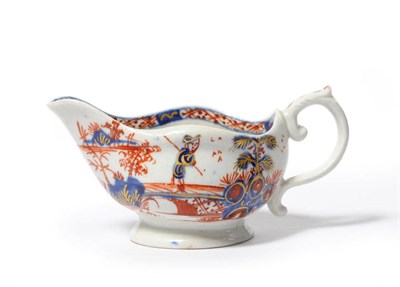 Lot 217 - A Vauxhall Porcelain Butter Boat, circa 1760, of oval form with scroll handle, painted in the Imari